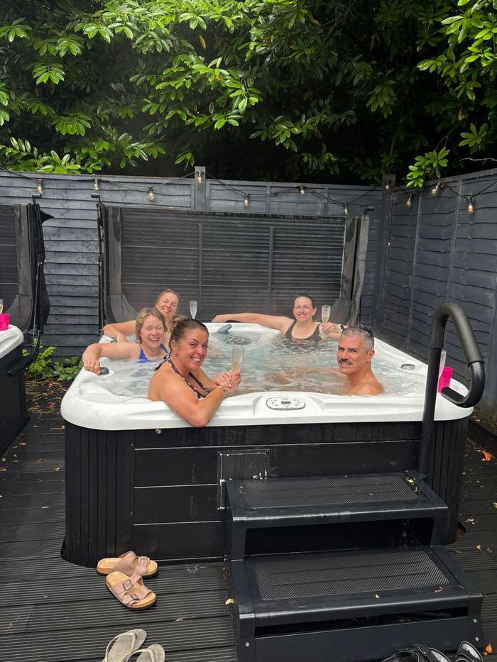 Ascend members relaxing in the hot tub