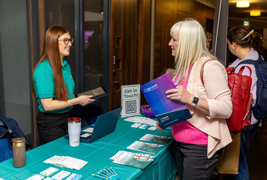 Clinic owners visiting a sponsor stand at Clinic Growth Live