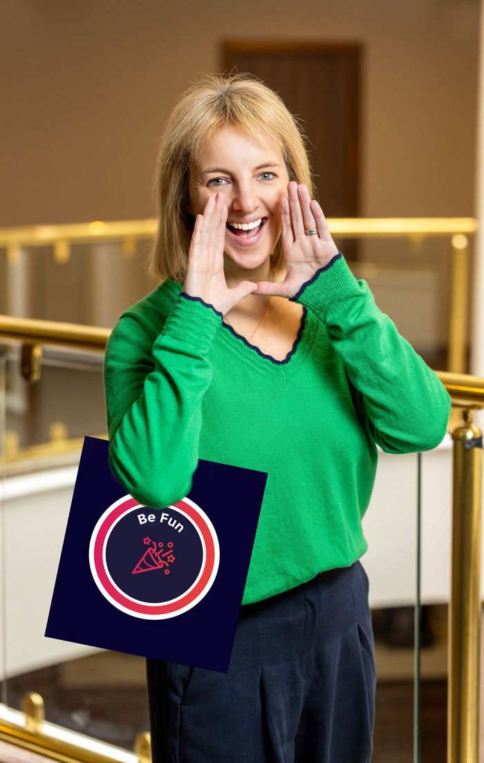 Fiona Moir holding the Be Fun values board