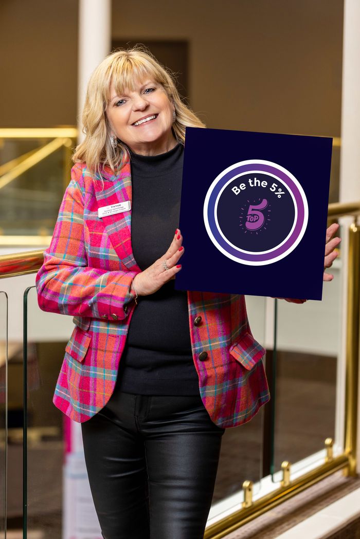 Nichola Page holding the Be the 5% values board